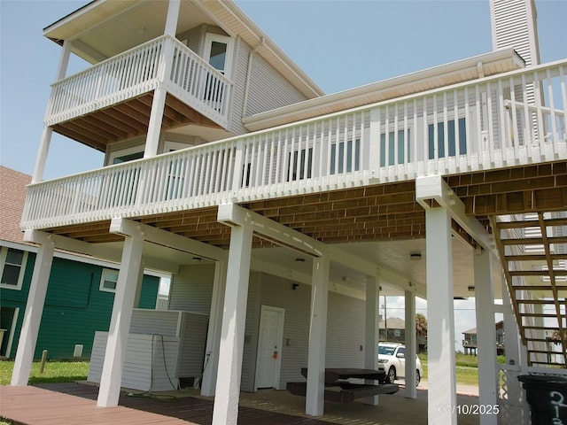 21315 Gulf Dr, Galveston, TX 77554 - back of property with stairway and a deck