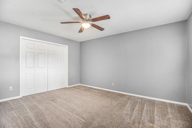 3014 Bayou Dr, La Porte, TX 77571 - unfurnished bedroom with carpet, a closet, and a ceiling fan