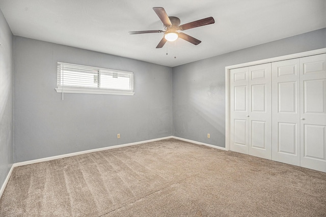 3014 Bayou Dr, La Porte, TX 77571 - unfurnished bedroom featuring carpet floors, a closet, and a ceiling fan