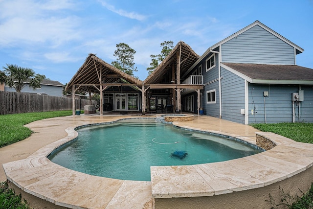 3014 Bayou Dr, La Porte, TX 77571 - view of pool with a patio area, french doors, a fenced backyard, and a pool with connected hot tub