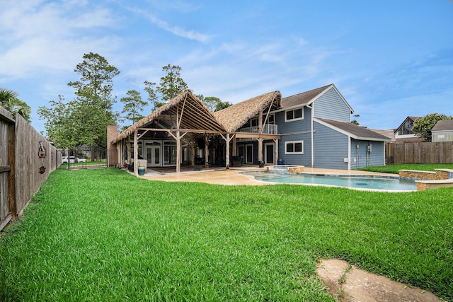 3014 Bayou Dr, La Porte, TX 77571 - rear view of house featuring a fenced backyard, a patio, french doors, roof with shingles, and a balcony