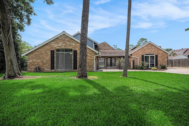 3014 Bayou Dr, La Porte, TX 77571 - view of front of property with brick siding and a gate