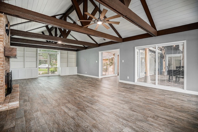 3014 Bayou Dr, La Porte, TX 77571 - unfurnished living room with a brick fireplace, wood finished floors, a ceiling fan, and wood ceiling