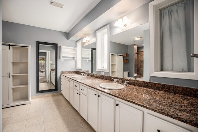 3014 Bayou Dr, La Porte, TX 77571 - full bathroom with double vanity and tile patterned floors