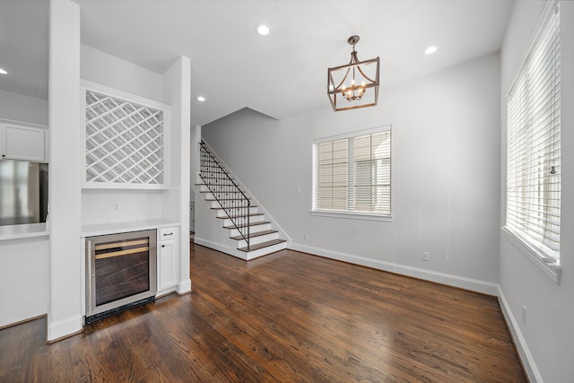 2924 Leeland St, Houston, TX 77003 - unfurnished living room with wine cooler, a dry bar, plenty of natural light, stairway, and recessed lighting