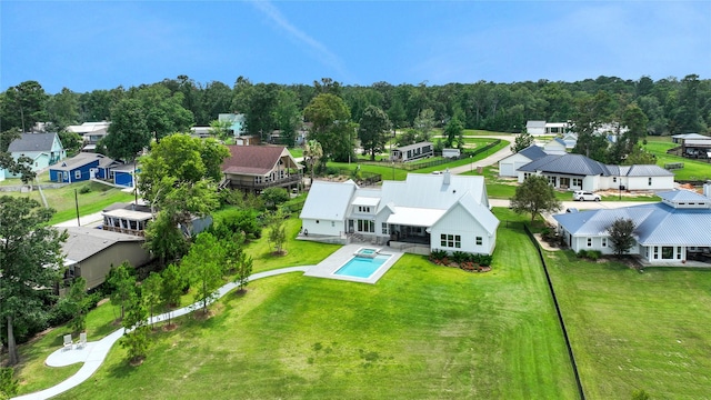 110 Penguin Pt, Point Blank, TX 77364 - aerial perspective of suburban area with a pool