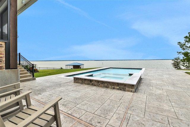 110 Penguin Pt, Point Blank, TX 77364 - view of pool featuring an in-ground hot tub, a patio area, stairs, and a water view
