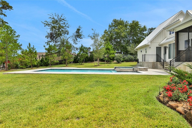110 Penguin Pt, Point Blank, TX 77364 - view of green lawn with a pool with connected hot tub and a patio area