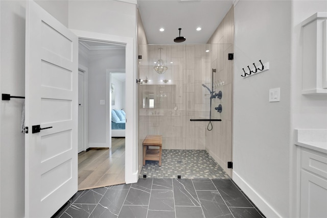 110 Penguin Pt, Point Blank, TX 77364 - ensuite bathroom featuring tiled shower, recessed lighting, and marble look tile flooring