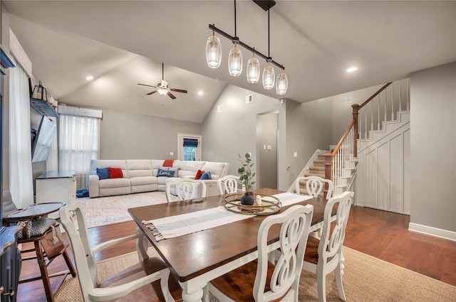 10252 Sunset Ln, Conroe, TX 77385 - dining space with wood finished floors, ceiling fan, vaulted ceiling, recessed lighting, and stairway