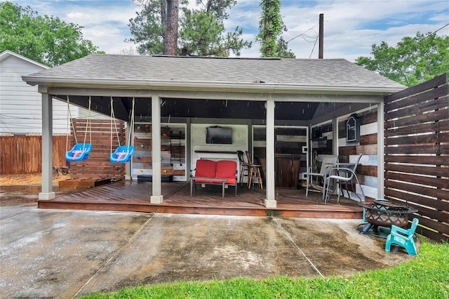 10252 Sunset Ln, Conroe, TX 77385 - rear view of property with roof with shingles and a wooden deck