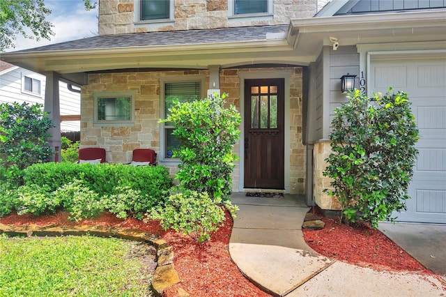 10252 Sunset Ln, Conroe, TX 77385 - doorway to property featuring stone siding and roof with shingles