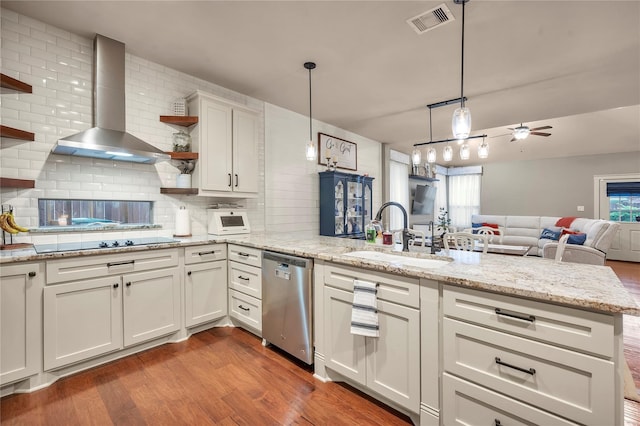 10252 Sunset Ln, Conroe, TX 77385 - kitchen with stainless steel dishwasher, wall chimney range hood, a peninsula, open shelves, and decorative backsplash