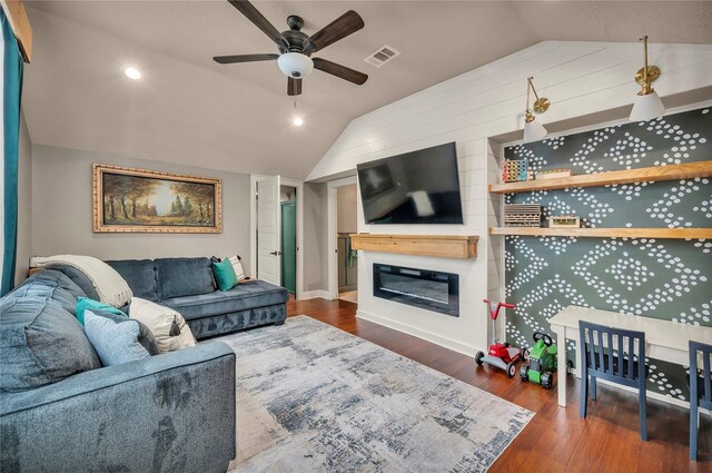 10252 Sunset Ln, Conroe, TX 77385 - living area featuring vaulted ceiling, ceiling fan, wood finished floors, and a glass covered fireplace