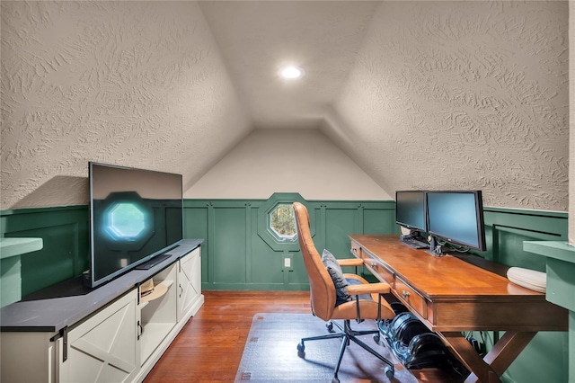 10252 Sunset Ln, Conroe, TX 77385 - office space with a textured ceiling, wood finished floors, vaulted ceiling, a wainscoted wall, and a decorative wall