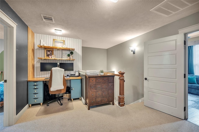 10252 Sunset Ln, Conroe, TX 77385 - home office with carpet floors and a textured ceiling