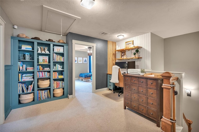 10252 Sunset Ln, Conroe, TX 77385 - office area with attic access, carpet flooring, a textured ceiling, and ceiling fan