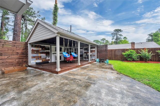 10252 Sunset Ln, Conroe, TX 77385 - fenced backyard with a sunroom, a patio area, and a deck