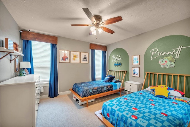 10252 Sunset Ln, Conroe, TX 77385 - bedroom featuring carpet floors, a ceiling fan, and a textured ceiling
