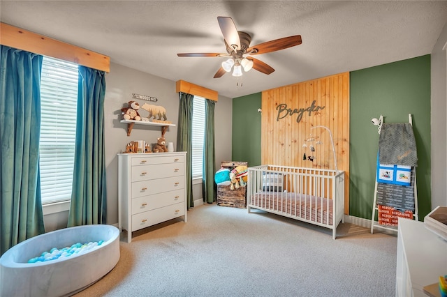 10252 Sunset Ln, Conroe, TX 77385 - carpeted bedroom with a nursery area and a ceiling fan