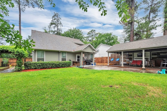 10252 Sunset Ln, Conroe, TX 77385 - rear view of house with a patio area and a shingled roof