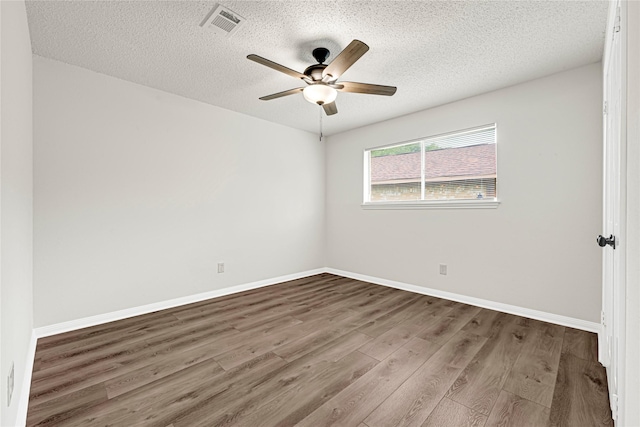 4005 Stoneybrook St, Baytown, TX 77521 - empty room with a textured ceiling, wood finished floors, and ceiling fan