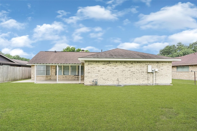 4005 Stoneybrook St, Baytown, TX 77521 - rear view of house with a fenced backyard, brick siding, and a patio area