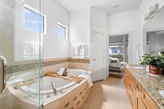 2310 Arabelle St, Houston, TX 77007 - full bath featuring healthy amount of natural light, a bath, double vanity, and a shower stall