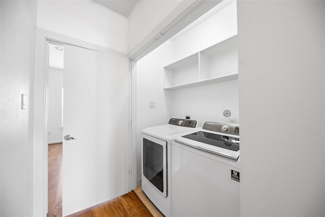 2310 Arabelle St, Houston, TX 77007 - laundry room featuring separate washer and dryer and light wood finished floors
