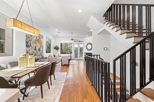 2310 Arabelle St, Houston, TX 77007 - dining area with light wood finished floors, a ceiling fan, recessed lighting, and stairway