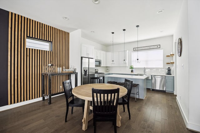 2212 Mcgowen St, Houston, TX 77004 - dining area with dark wood-style flooring and recessed lighting