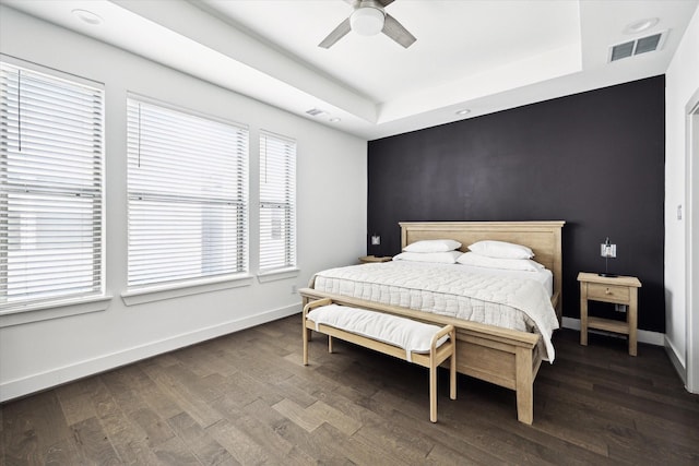 2212 Mcgowen St, Houston, TX 77004 - bedroom featuring a raised ceiling, dark wood-style flooring, and ceiling fan