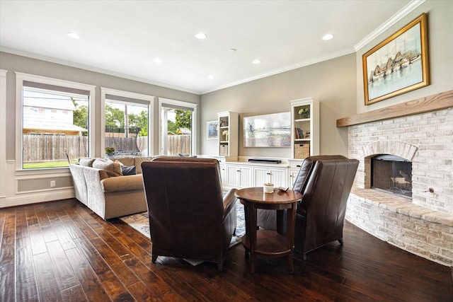 1346 Thornton Rd, Houston, TX 77018 - living room featuring ornamental molding, dark wood-type flooring, a fireplace, and recessed lighting