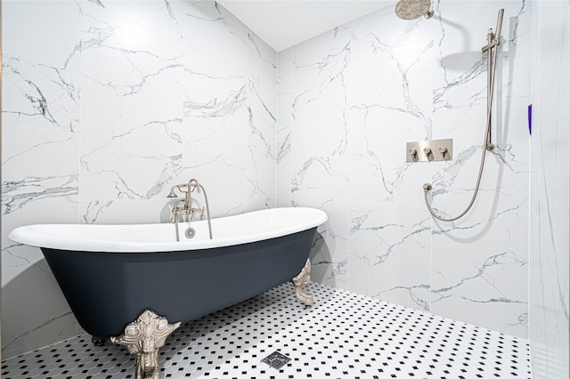 3217 Parkwood Dr, Houston, TX 77021 - full bath featuring stone wall, tile walls, a marble finish shower, and a freestanding tub