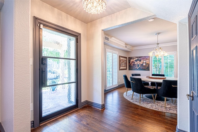 3217 Parkwood Dr, Houston, TX 77021 - dining space featuring a chandelier, dark wood-style flooring, and ornamental molding
