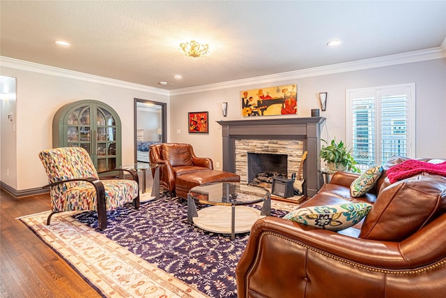 3217 Parkwood Dr, Houston, TX 77021 - living room featuring wood finished floors, a fireplace, ornamental molding, and recessed lighting