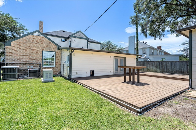 3217 Parkwood Dr, Houston, TX 77021 - rear view of property featuring a wooden deck, a chimney, french doors, and brick siding
