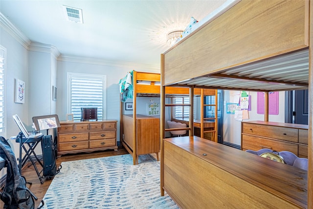 3217 Parkwood Dr, Houston, TX 77021 - bedroom with wood finished floors, ornamental molding, multiple windows, and a chandelier