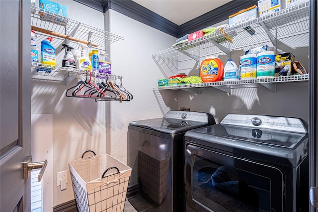 3217 Parkwood Dr, Houston, TX 77021 - washroom featuring washing machine and clothes dryer, ornamental molding, and a textured wall
