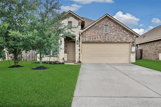22223 Ebbets Field Dr, Spring, TX 77389 - french provincial home featuring a front lawn, concrete driveway, brick siding, a garage, and stone siding