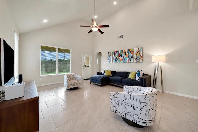22223 Ebbets Field Dr, Spring, TX 77389 - living area with ceiling fan, light tile patterned flooring, arched walkways, recessed lighting, and high vaulted ceiling