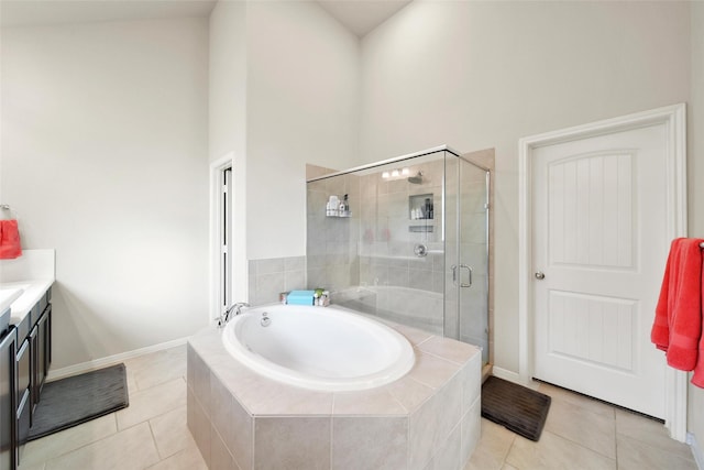 22223 Ebbets Field Dr, Spring, TX 77389 - full bathroom with a garden tub, a stall shower, tile patterned flooring, vanity, and a high ceiling