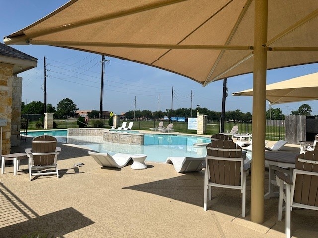 22223 Ebbets Field Dr, Spring, TX 77389 - community pool featuring a patio area and a hot tub