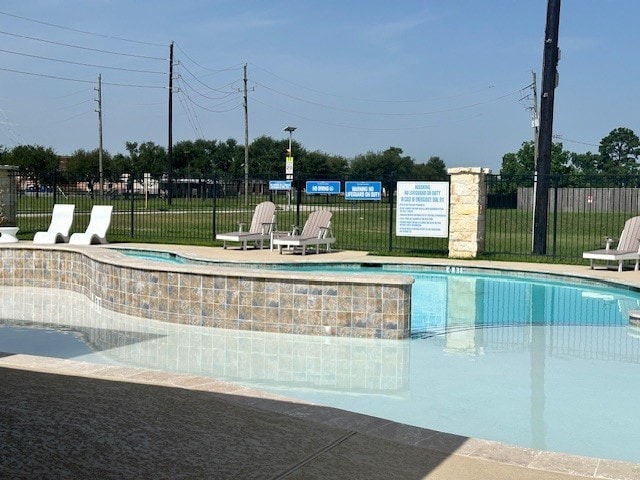 22223 Ebbets Field Dr, Spring, TX 77389 - community pool featuring a hot tub