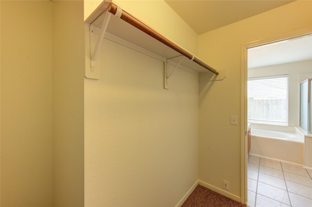 20218 Cypresswood Gln, Spring, TX 77373 - spacious closet with light tile patterned floors