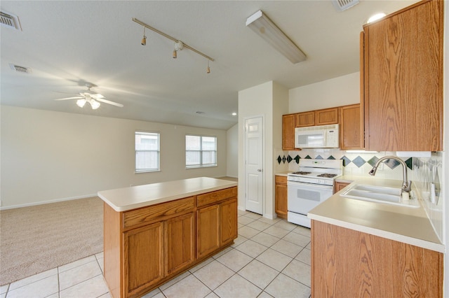 20218 Cypresswood Gln, Spring, TX 77373 - kitchen with white appliances, light tile patterned floors, a ceiling fan, and light countertops