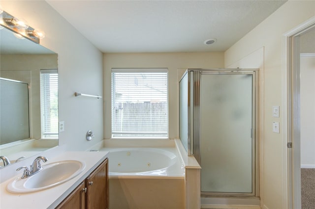 20218 Cypresswood Gln, Spring, TX 77373 - bathroom featuring vanity, a shower stall, plenty of natural light, and a whirlpool tub
