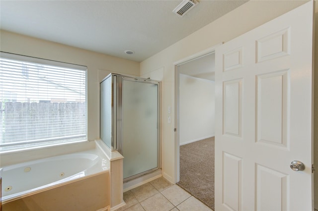 20218 Cypresswood Gln, Spring, TX 77373 - bathroom featuring a shower stall, a jetted tub, and tile patterned floors