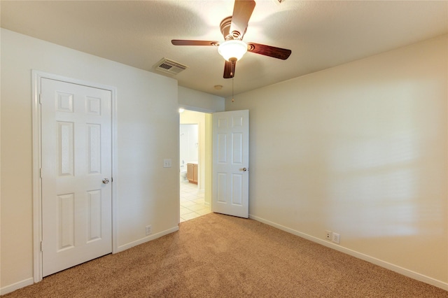 20218 Cypresswood Gln, Spring, TX 77373 - unfurnished bedroom with light carpet and ceiling fan