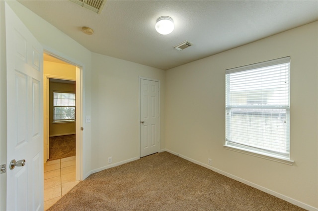 20218 Cypresswood Gln, Spring, TX 77373 - unfurnished bedroom featuring light colored carpet and baseboards
